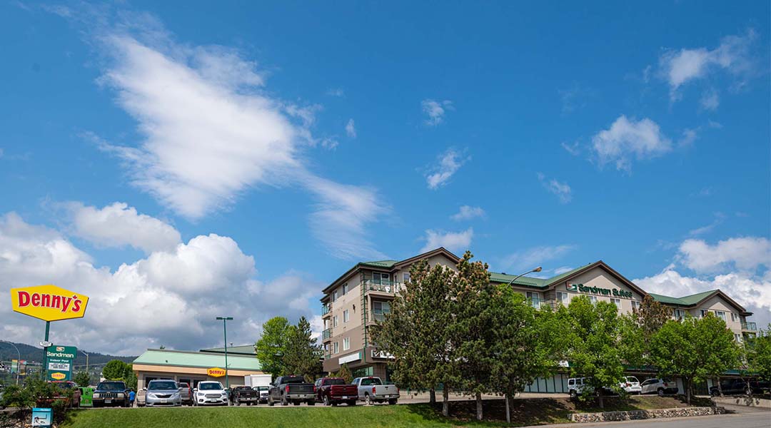 Exterior of the Sandman Hotel and Suites Williams Lake with blue sky Exterior of the Sandman Hotel and Suites Williams Lake with blue sky