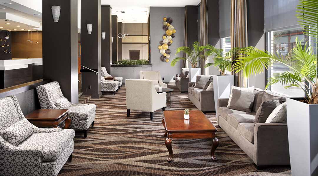 Couches and arm chairs in hotel lobby