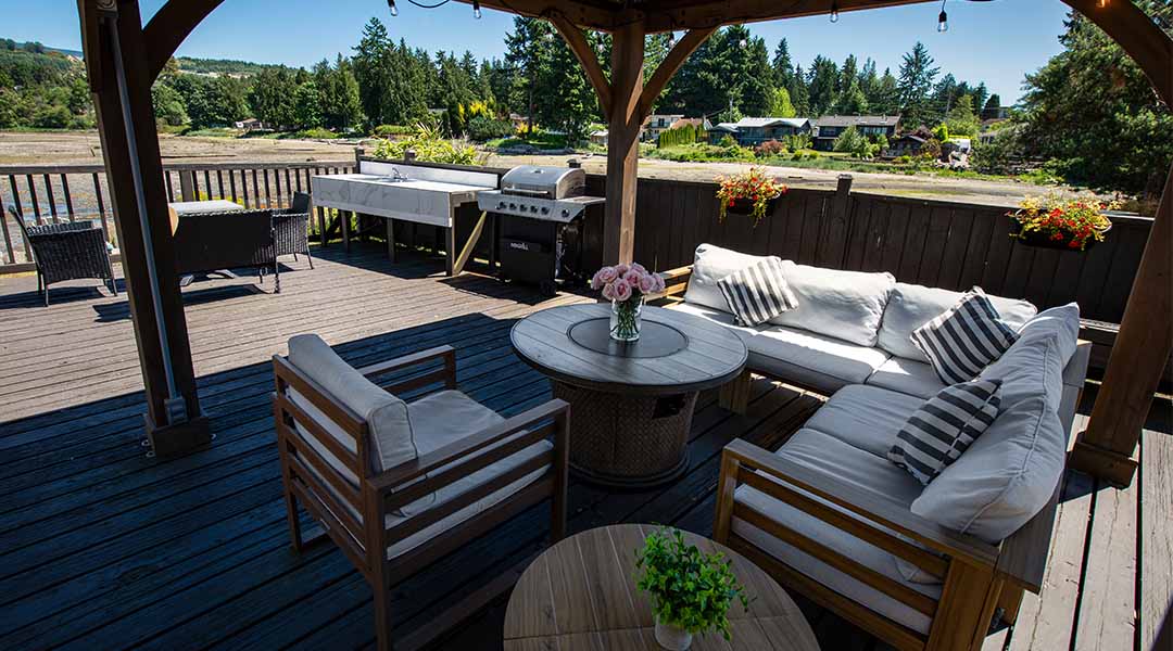 Outdoor seating area at the Spot at Porpoise Bay featuring couches and a firepit
