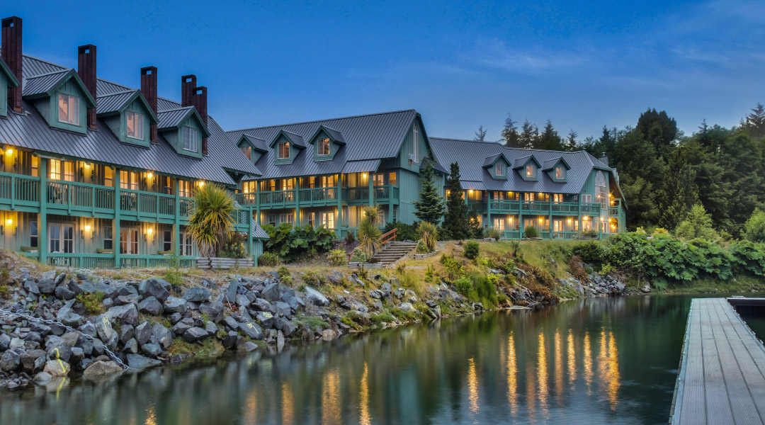Exterior view of the lodge at dusk Exterior view of the lodge at dusk