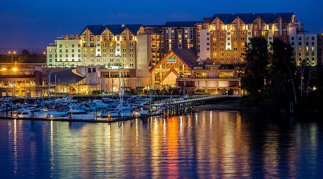 Exterior of River Rock Casino Resort reflecting on water in the evening in Richmond Exterior of River Rock Casino Resort reflecting on water in the evening in Richmond