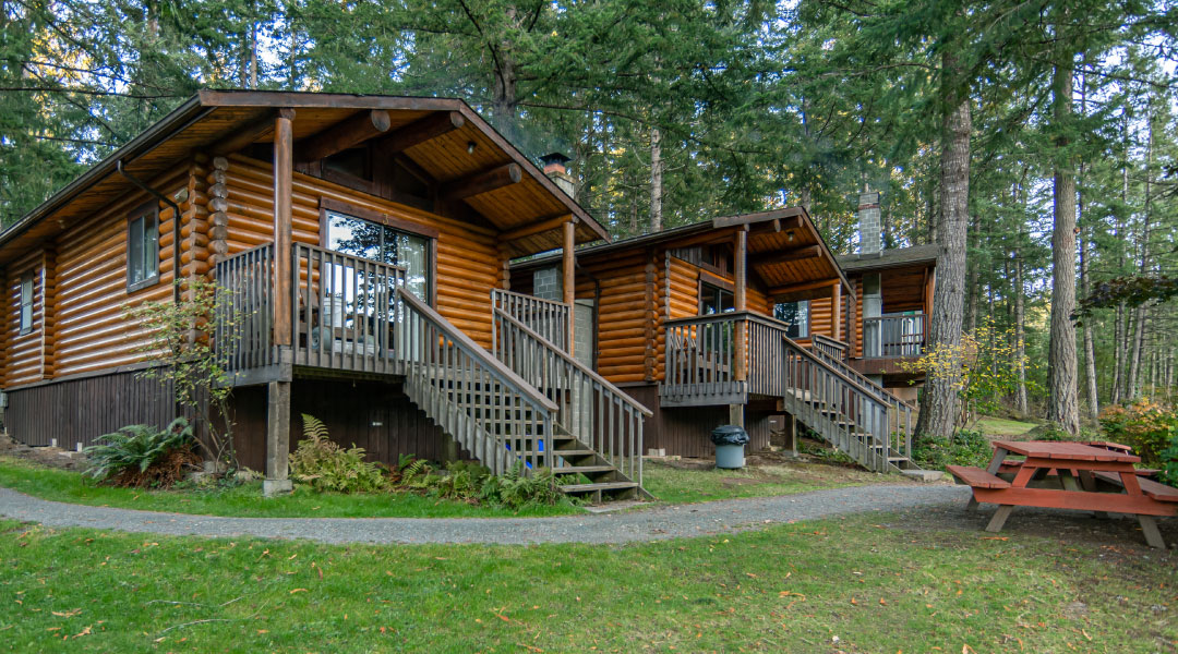 The exterior of two wooden cabins at Cusheon Lake Resort on Salt Spring Island The exterior of two wooden cabins at Cusheon Lake Resort on Salt Spring Island