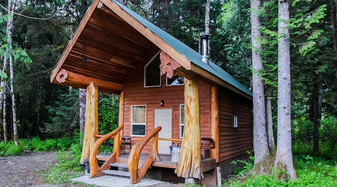 Exterior entrance and balcony of the Chalet Two-Cinnamon Bear at the Bella Coola Grizzly Tours in the Cariboo Chilcotin Coast Exterior entrance and balcony of the Chalet Two-Cinnamon Bear at the Bella Coola Grizzly Tours in the Cariboo Chilcotin Coast