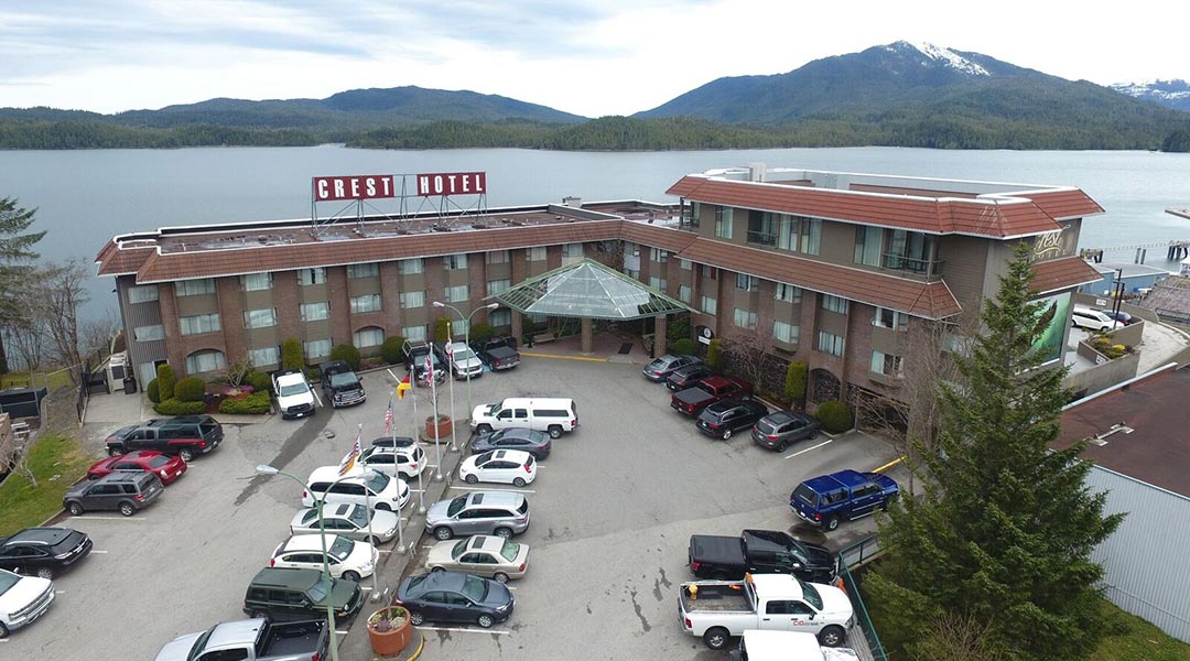 An aerial view of the exterior entrance and building of the Crest Hotel in Prince Rupert by the harbour in Northern BC An aerial view of the exterior entrance and building of the Crest Hotel in Prince Rupert by the harbour in Northern BC