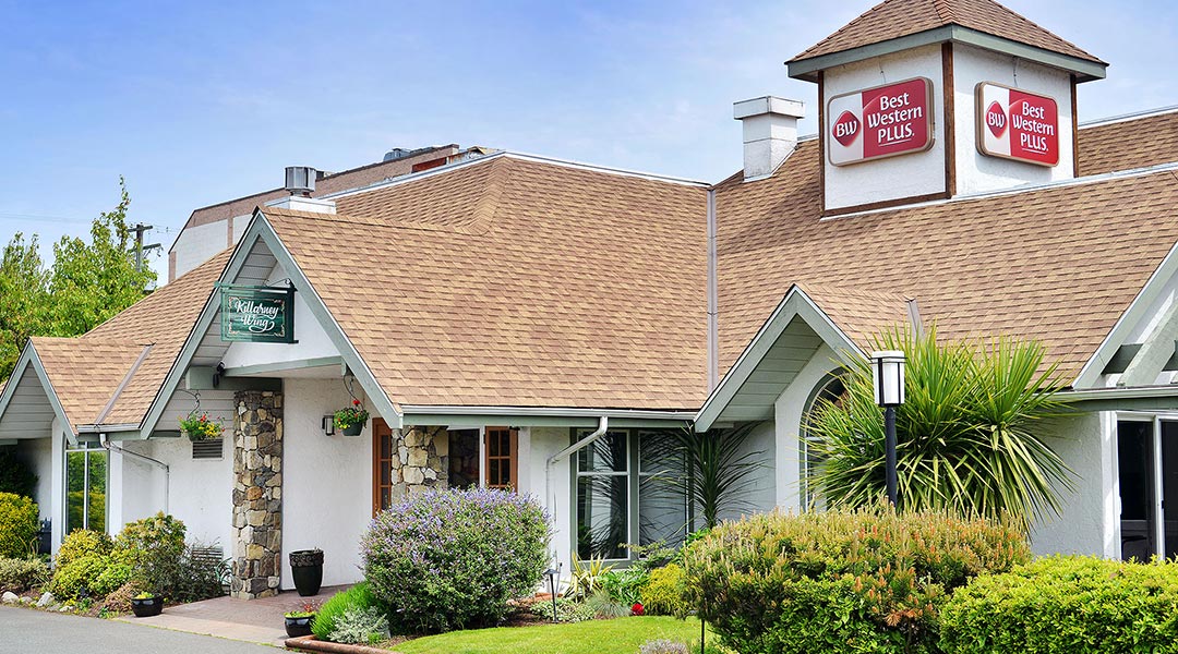 The exterior building of the Killarney wing at the Best Western Plus Emerald Isle Hotel in Sidney The exterior building of the Killarney wing at the Best Western Plus Emerald Isle Hotel in Sidney