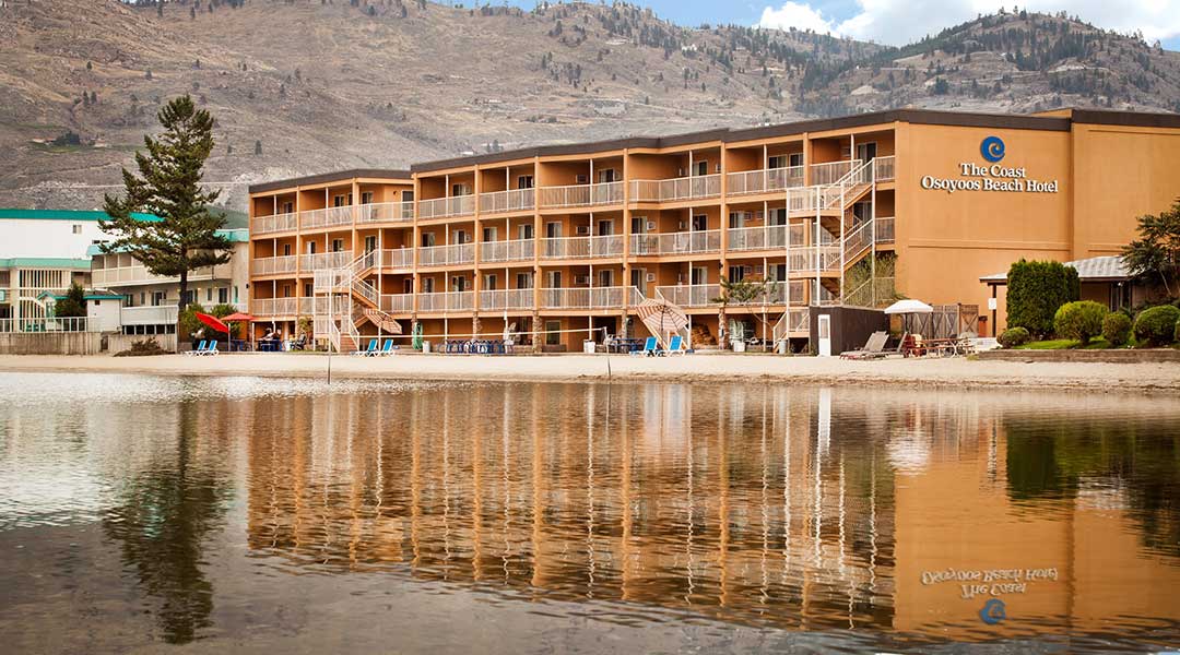 The exterior building of the Coast Osoyoos Beach Hotel by the lake in Thompson Okanagan The exterior building of the Coast Osoyoos Beach Hotel by the lake in Thompson Okanagan