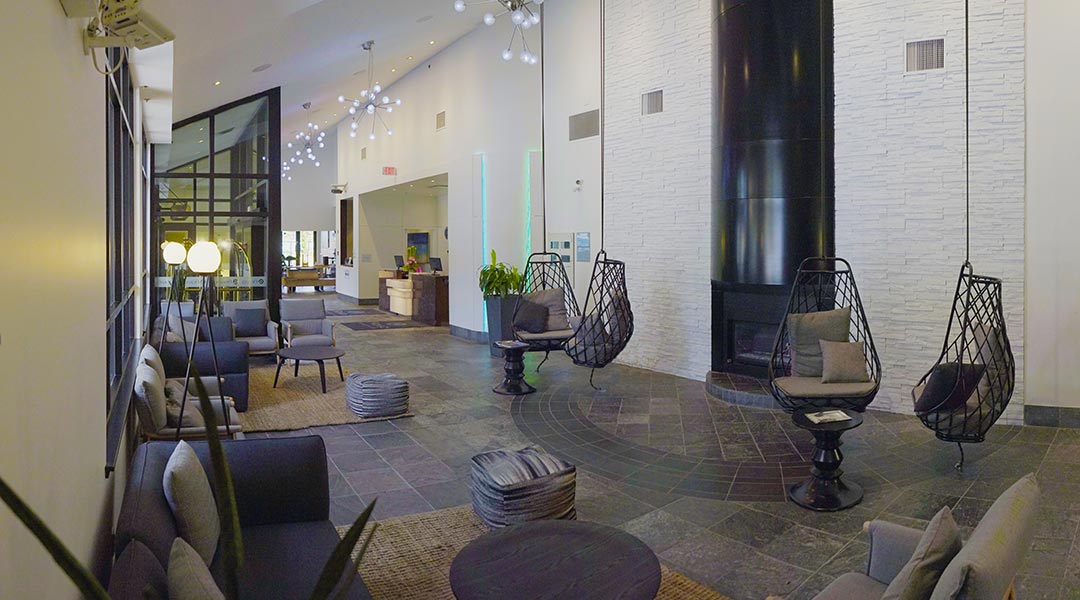 The interior lobby with seating at the Aava Whistler Hotel in the Coast Mountains