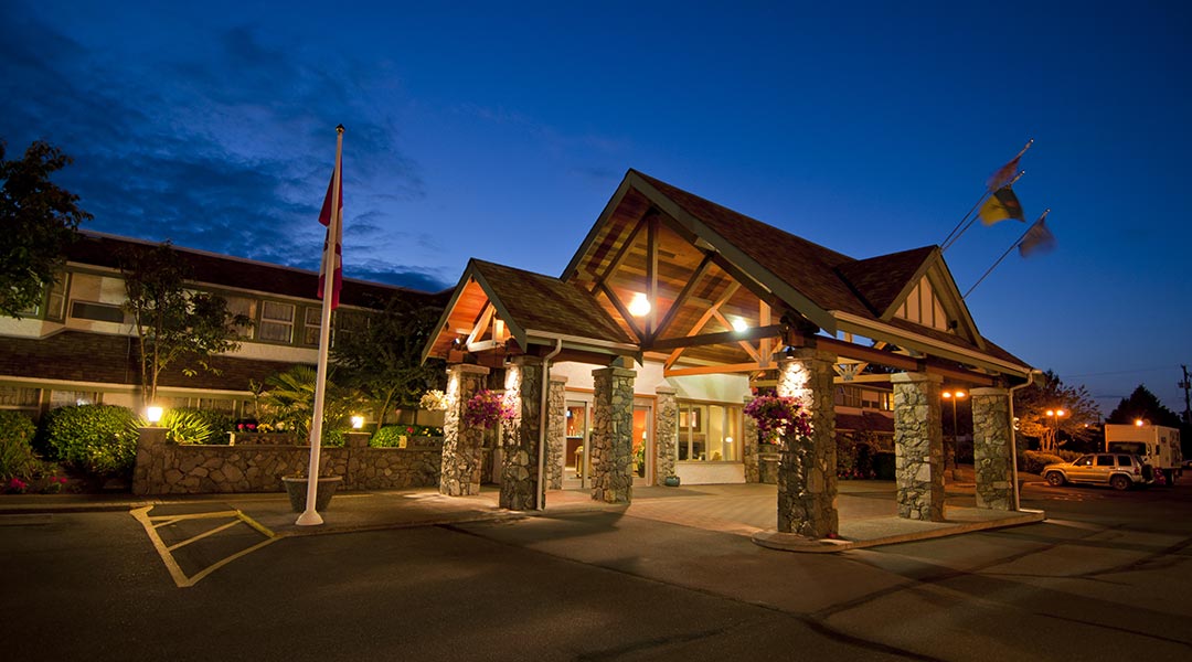 The exterior building of the Best Western Plus Emerald Isle Hotel in Sidney at night The exterior building of the Best Western Plus Emerald Isle Hotel in Sidney at night