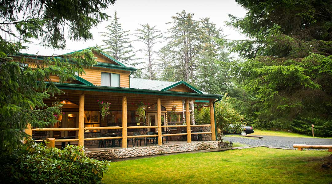 The exterior entrance and parking lot of the Haida House at Tlall Bed and Breakfast in Haida Gwaii The exterior entrance and parking lot of the Haida House at Tlall Bed and Breakfast in Haida Gwaii