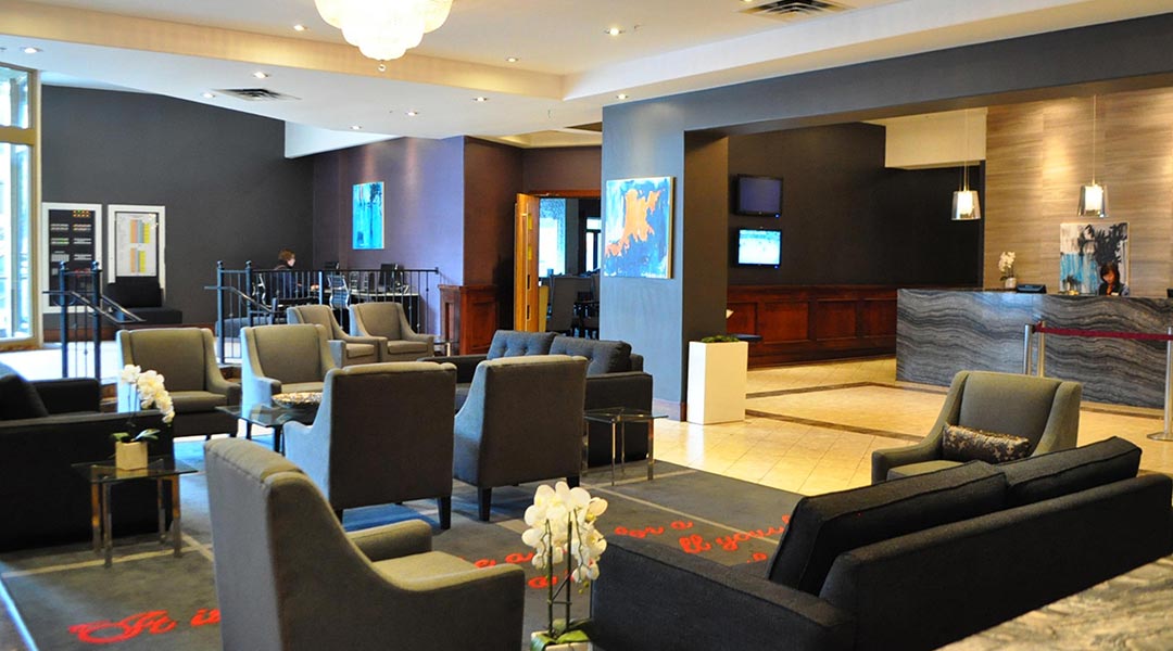 The front desk in the lobby with seating at the Sandman Hotel Vancouver City Centre in Downtown Vancouver The front desk in the lobby with seating at the Sandman Hotel Vancouver City Centre in Downtown Vancouver