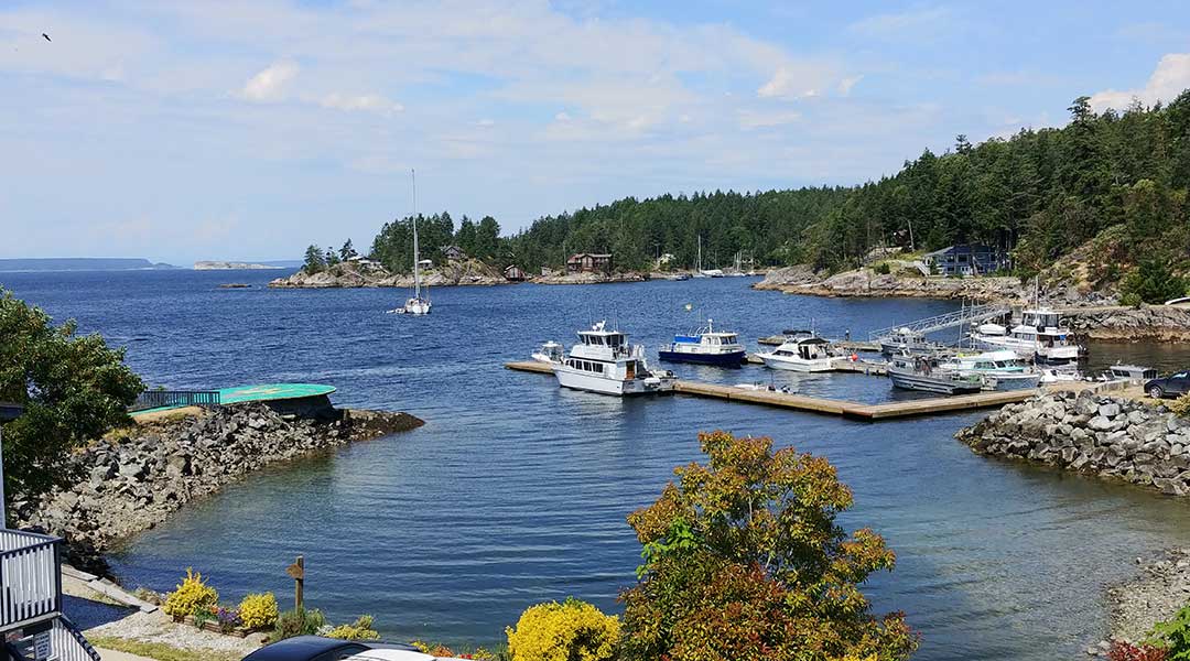 Finn Bay view of dock and ocean at The Lund Resort at Klah Ah Men near Powell River BC on the Sunshine Coast Finn Bay view of dock and ocean at The Lund Resort at Klah Ah Men near Powell River BC on the Sunshine Coast