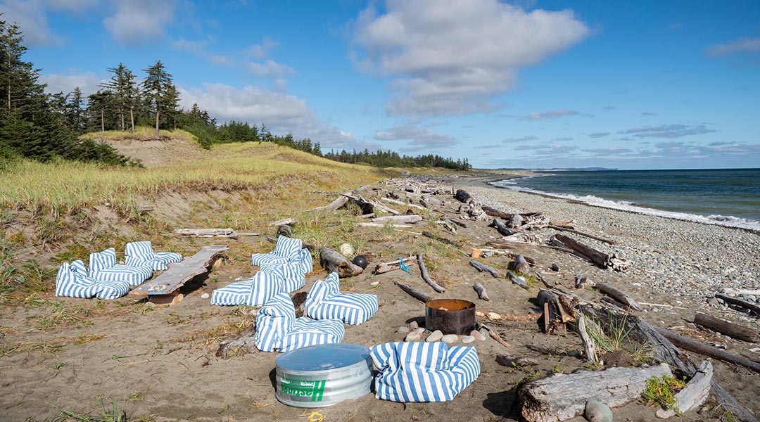 The beach view with bean bag chairs at the Haida Gwaii Glamping Co The beach view with bean bag chairs at the Haida Gwaii Glamping Co