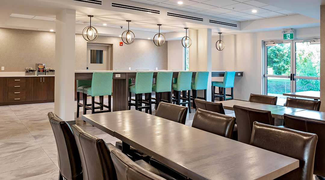 Dining tables and bar in the breakfast area at the Coast Oliver Hotel in Thompson Okanagan Dining tables and bar in the breakfast area at the Coast Oliver Hotel in Thompson Okanagan