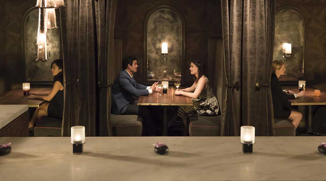 Couples dining in booths at the notch 8 restaurant in the Fairmont Hotel Vancouver in downtown Vancouver