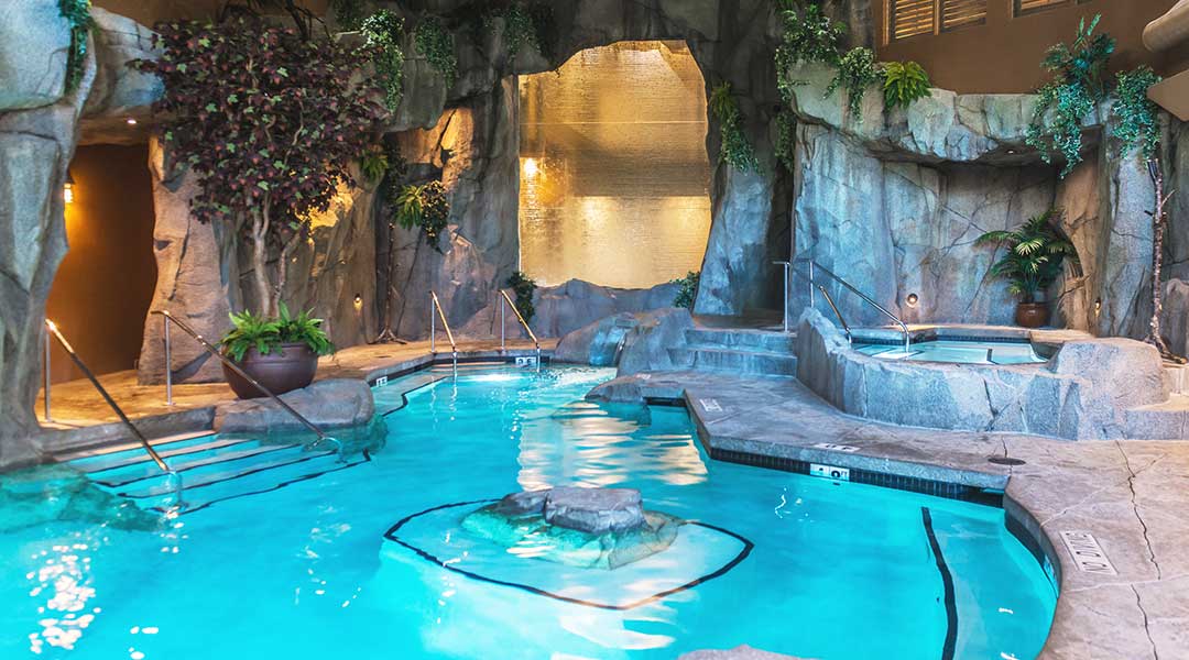 Indoor pool with hot tub and grotto at Tigh Na Mara Resort and Spa in Parksville Indoor pool with hot tub and grotto at Tigh Na Mara Resort and Spa in Parksville