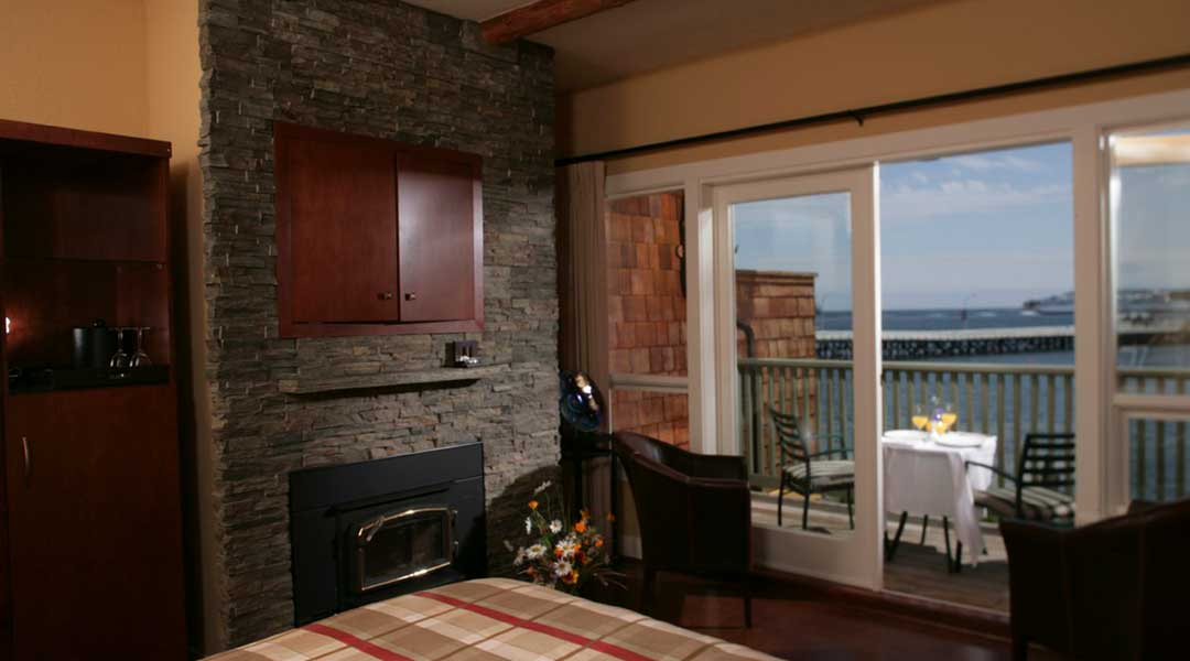 The oceanfront queen west coast suite room with a ocean view balcony at the Galiano Oceanfront Inn and Spa on Galiano Island The oceanfront queen west coast suite room with a ocean view balcony at the Galiano Oceanfront Inn and Spa on Galiano Island
