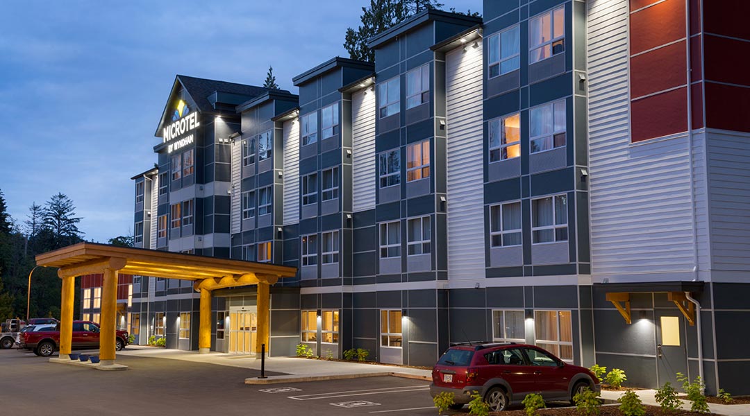 The exterior building and parking lot of the Microtel Inn and Suites by Wyndham Ladysmith Oyster Bay at dusk The exterior building and parking lot of the Microtel Inn and Suites by Wyndham Ladysmith Oyster Bay at dusk