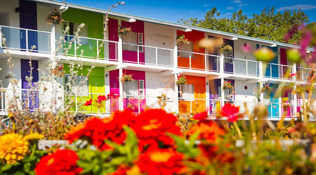 Exterior of Hotel Zed Victoria with rainbow colours painted on side