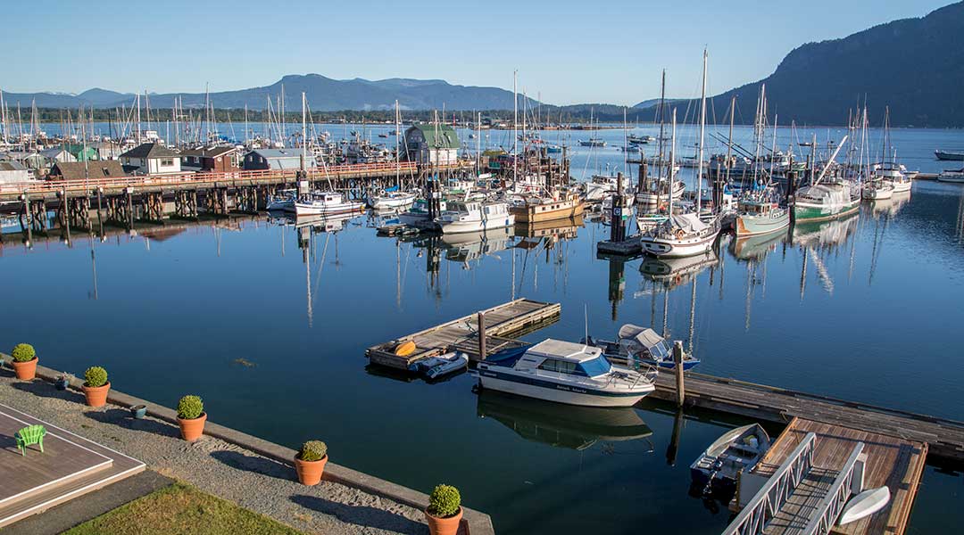 Marina with docks and boats at the Oceanfront Suites at Cowichan Bay Marina with docks and boats at the Oceanfront Suites at Cowichan Bay