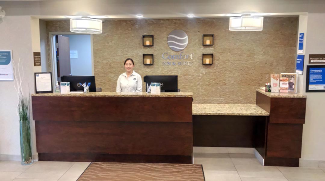 Person at the front lobby desk at the Comfort Inn and Suites Terrace in Northern BC Person at the front lobby desk at the Comfort Inn and Suites Terrace in Northern BC