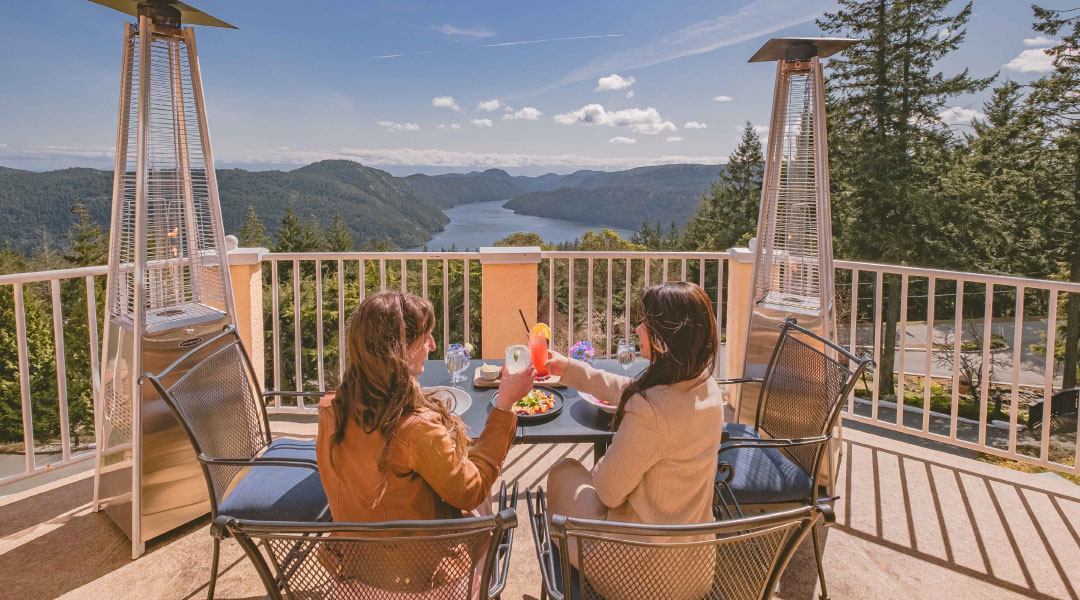 Women enjoying the patio at Villa Eyrie Resort Women enjoying the patio at Villa Eyrie Resort
