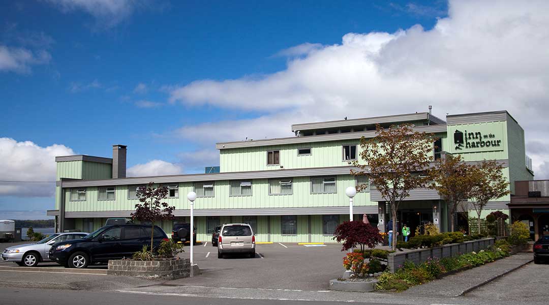 Exterior of Inn on the Harbour in Prince Rupert with parking lot out front Exterior of Inn on the Harbour in Prince Rupert with parking lot out front