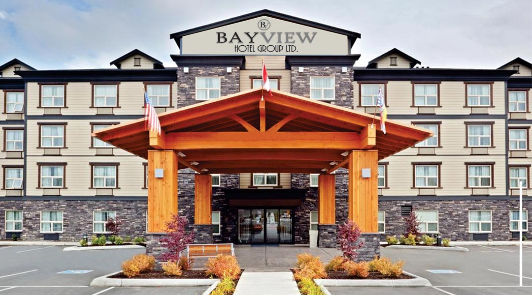 The exterior building and entrance of the Bayview Hotel Group Ltd in Comox and parking lot The exterior building and entrance of the Bayview Hotel Group Ltd in Comox and parking lot