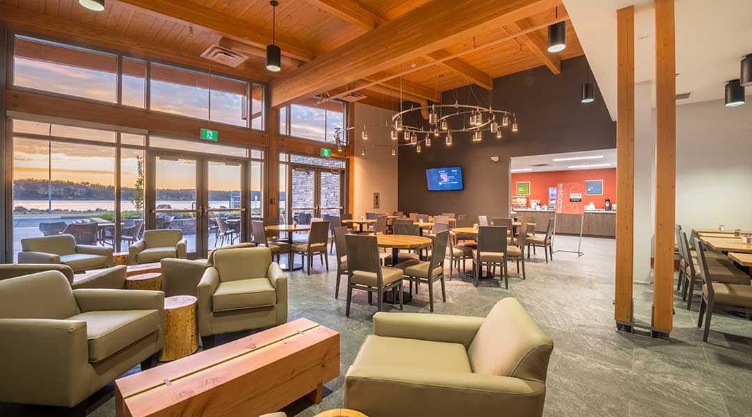 The indoor lobby and dining area at the Comfort Inn and Suites Campbell River on Vancouver Island by the ocean The indoor lobby and dining area at the Comfort Inn and Suites Campbell River on Vancouver Island by the ocean