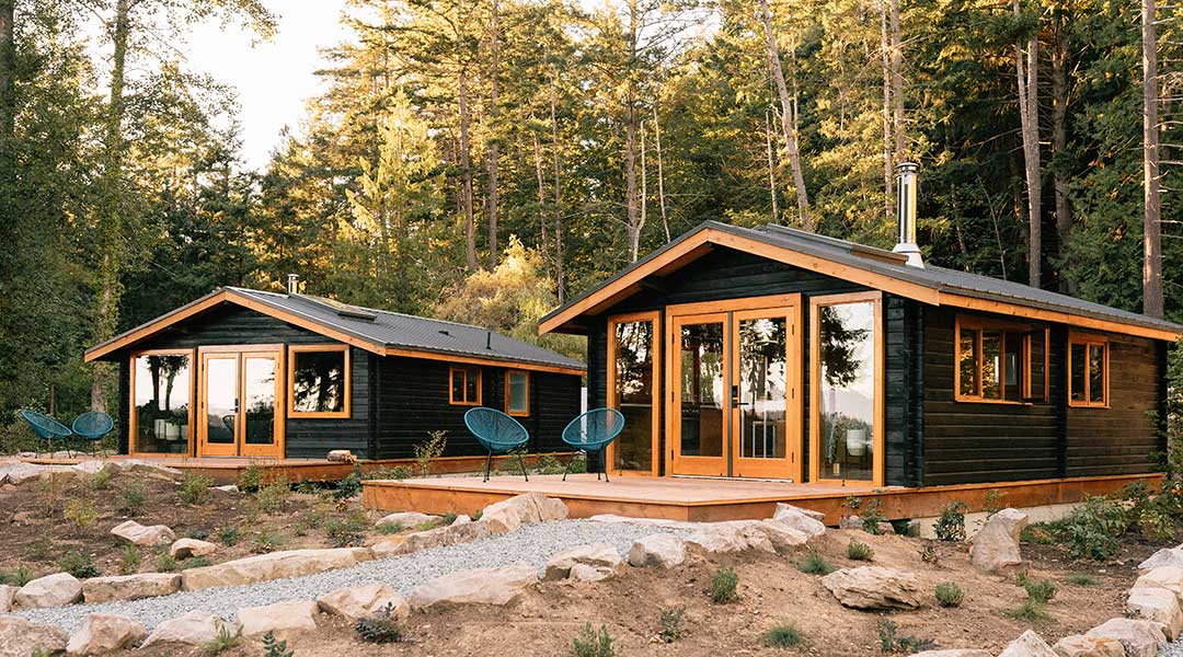The exterior entrance to the wooden cabins of Bodega Cove on Galiano Island The exterior entrance to the wooden cabins of Bodega Cove on Galiano Island
