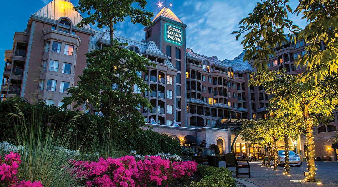 The exterior driveway and building of the Hotel Grand Pacific in Victoria BC by the harbour The exterior driveway and building of the Hotel Grand Pacific in Victoria BC by the harbour