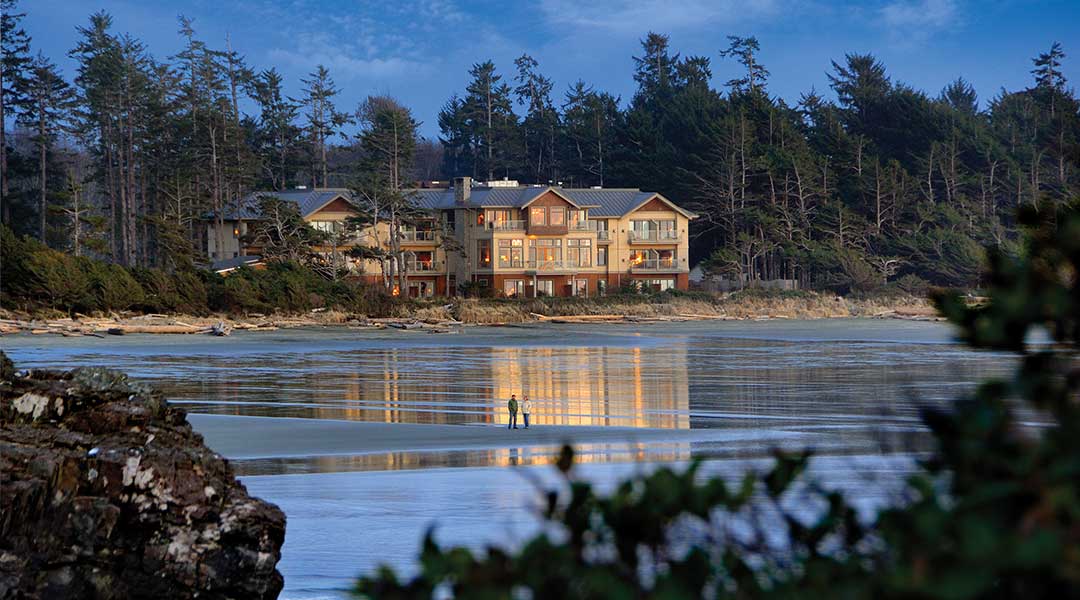 Exterior of Long Beach Lodge Resort from beach at dusk in Tofino Exterior of Long Beach Lodge Resort from beach at dusk in Tofino